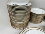 a lot of plates and bowls stacked on top of each other