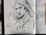 sketches of a woman ' s face in a book with black ink