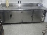 a large stainless steel counter in a commercial kitchen