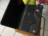 a laptop and a laptop computer sitting on a table