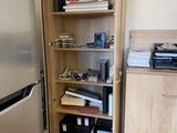 a silver refrigerator and a silver refrigerator freezer in a room