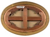 a wooden circular window with a sticker on it