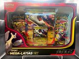 display of pokemon cards in a display case on a black surface