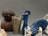 many different types of vases and plates on the table