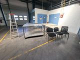 a room with chairs and a table in it