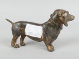 figurine of a dog with a bandage on its chest
