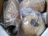 a box with two rolls of string wrapped in plastic