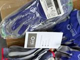 a box of gloves and a pair of gloves on the floor