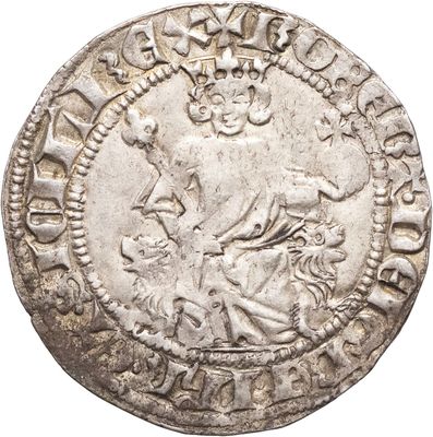 gros plan d'une pièce de monnaie en argent sur fond blanc