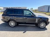 a picture of a black land rover parked in a parking lot