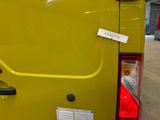 a yellow van with a sticker on the back of it