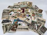 a pile of old postcards sitting on a table