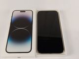 two iphones are sitting side by side on a white surface