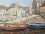 two boats that are sitting in the sand