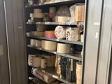 a metal cabinet with many items on it in a room