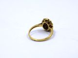 an image of a gold ring with a skull head on it