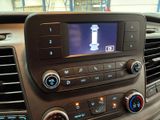 a picture of a car dashboard with a clock on it