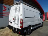 a white van that is parked in front of a building