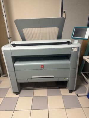 a printer that is sitting on the floor in the room