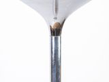 a close up of a glass table with a metal base