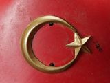 a close up of a metal object with a star on it