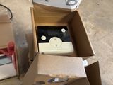 a box that has a remote in it and a box with a remote inside of it