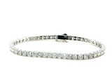a diamond tennis bracelet on a white background