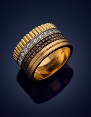 a gold and diamond ring, by business