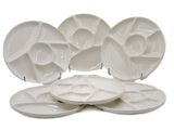 five plates that are sitting on top of each other