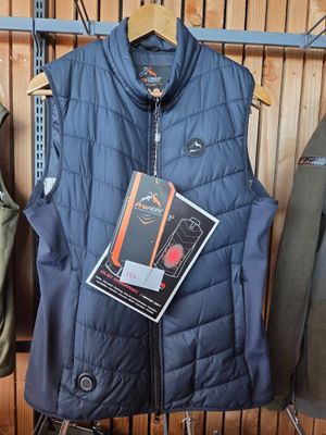a blue vest hanging on a rack in a store
