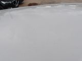 a close up of a white plate on a wooden table