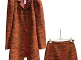 two pieces of clothing on a hanger and a skirt