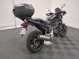 a black motorcycle with a helmet on the back of it