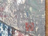 a painting on the wall of a building with a cat sitting on it
