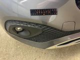 a close up of a car ' s bumper with a sticker on it