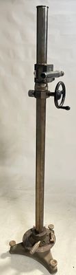 a tall metal pole with a top hat on it