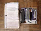 a box with a bunch of papers in it on the floor