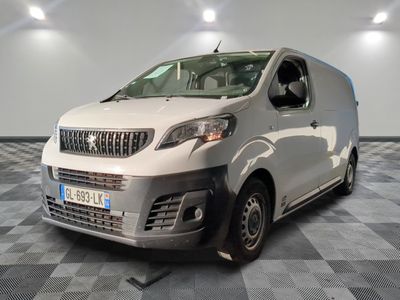 a white van that is parked on a checkered floor