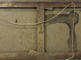 a picture of an old window with a rope hanging from it