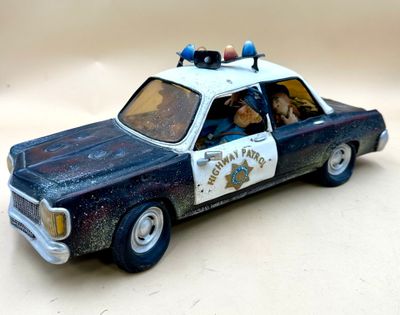 a toy police car that is sitting on a table