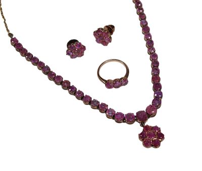 PARURE en argent doré serti griffes de pierres fines roses a…