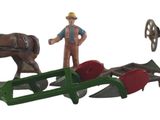 figurines représentant un homme debout à côté d'un traîneau tiré par des chevaux