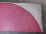a picture of a pink and white book on a table