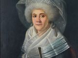 portrait of a woman in a white hat with a green bow