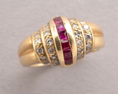 an image of a gold ring with rubies and diamonds