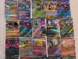 a pile of pokemon cards sitting on top of a table