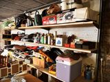 a room with a lot of items on the shelves