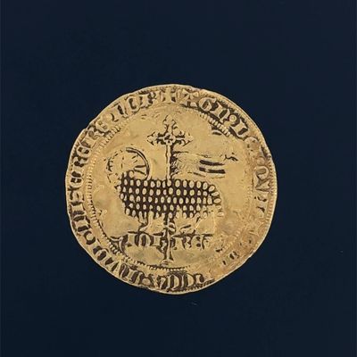 an image of a gold coin with a goat on it ' s back