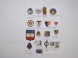 a picture of a wall with a bunch of badges on it