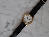 an image of a watch sitting on a marble counter top
